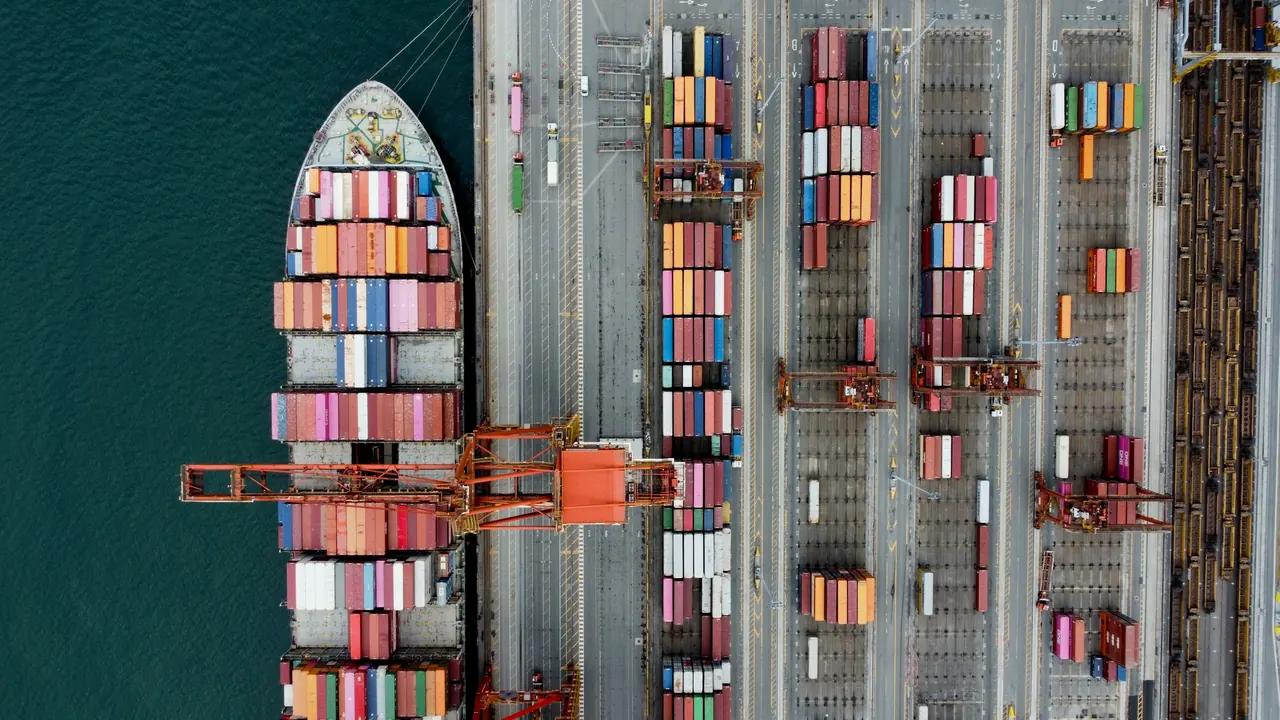 Aerial view of a container ship being loaded at a cargo port